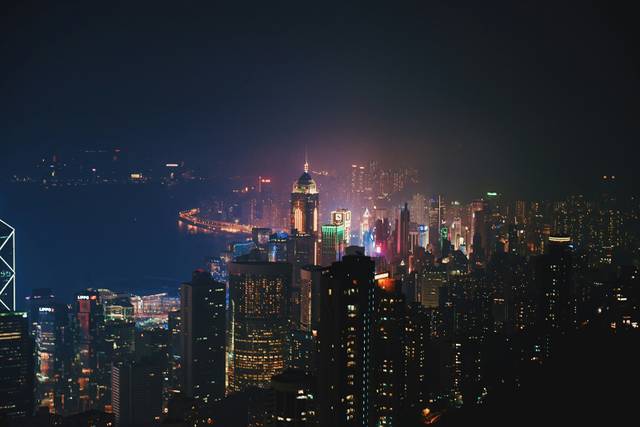 Hong Kong skyline at night with illuminated skyscrapers